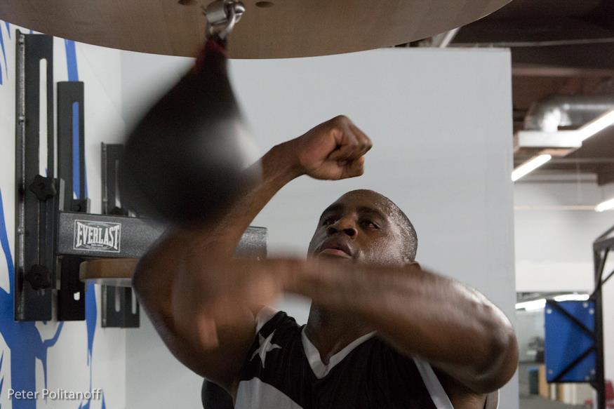 Me hitting the speedbag in the boxing gym
