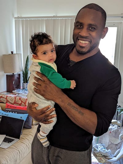 Ed Latimore with his son 3 month old that causes sleep deprivation