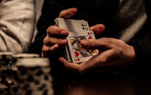 Man shuffling a deck of cards